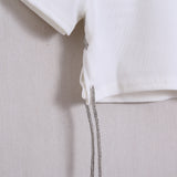 Geripptes T-Shirt mit Applikationen